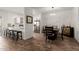 Open-concept dining room with a breakfast bar, leading into the kitchen and living spaces at 7064 W Lincoln St, Peoria, AZ 85345