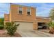 Inviting two-story townhome featuring attached two-car garage and well-maintained desert landscaping at 7064 W Lincoln St, Peoria, AZ 85345