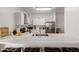 Bright kitchen features white cabinets, stainless appliances, and a spacious quartz countertop breakfast bar at 7064 W Lincoln St, Peoria, AZ 85345