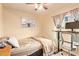 This bedroom features a standing desk with an office chair and a bed at 7114 W Oregon Ave, Glendale, AZ 85303
