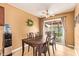 Cozy dining room with a wooden table set and sliding door access to the backyard at 7114 W Oregon Ave, Glendale, AZ 85303