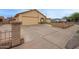 Single-story home with an attached two-car garage and brick-lined driveway at 7114 W Oregon Ave, Glendale, AZ 85303