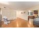 Comfortable living room with laminate flooring, neutral walls, and view of dining area at 7114 W Oregon Ave, Glendale, AZ 85303