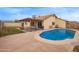 Backyard showcasing a sparkling blue pool, covered patio and fenced yard at 7114 W Oregon Ave, Glendale, AZ 85303