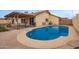 View of backyard pool, covered patio and fenced exterior at 7114 W Oregon Ave, Glendale, AZ 85303