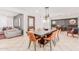 Inviting dining room seamlessly connects to the living area, featuring a dark accent wall at 7308 E Diamond St, Scottsdale, AZ 85257