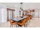 Bright dining area with backyard access, a spacious table, and modern pendant lighting at 7308 E Diamond St, Scottsdale, AZ 85257
