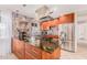 Stylish kitchen featuring unique backsplash, granite countertops, stainless steel appliances, and ample storage at 7308 E Diamond St, Scottsdale, AZ 85257