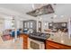 Open kitchen showcasing a gas range, granite countertops, and seamless flow into the living and dining areas at 7308 E Diamond St, Scottsdale, AZ 85257