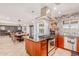 Modern kitchen leading to a dining area with a large table, views of the pool, and plenty of natural light at 7308 E Diamond St, Scottsdale, AZ 85257
