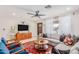Cozy living room with natural light, comfortable seating, stylish decor, and a ceiling fan at 7308 E Diamond St, Scottsdale, AZ 85257