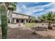 Beautiful backyard features desert landscaping, covered patio, and mature trees at 7308 S 29Th Ln, Phoenix, AZ 85041