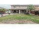 Large backyard featuring a covered patio, mature tree, and desert landscaping at 7308 S 29Th Ln, Phoenix, AZ 85041
