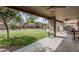 Grassy backyard offering covered patio, ceiling fan, and well maintained lawn at 7308 S 29Th Ln, Phoenix, AZ 85041