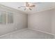 Modest bedroom featuring neutral walls, window for natural light, and carpet at 7308 S 29Th Ln, Phoenix, AZ 85041