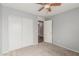 Simple bedroom offering neutral walls, closet, and standard door leading to other rooms at 7308 S 29Th Ln, Phoenix, AZ 85041