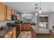 Well-lit kitchen featuring granite countertops, stainless steel appliances, and tile backsplash at 7308 S 29Th Ln, Phoenix, AZ 85041