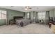 Cozy main bedroom boasts a ceiling fan, carpet, and modern curtains at 7308 S 29Th Ln, Phoenix, AZ 85041