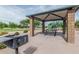 Community picnic area near playground featuring barbeque at 7308 S 29Th Ln, Phoenix, AZ 85041