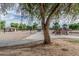Community playground with covered picnic area and volleyball court in the distance at 7308 S 29Th Ln, Phoenix, AZ 85041