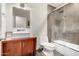 Modern bathroom featuring a vessel sink, wooden vanity, and a tiled shower with glass door at 8314 E Vista Dr, Scottsdale, AZ 85250