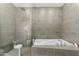 Modern bathroom showcasing a glass shower enclosure and a soaking tub at 8314 E Vista Dr, Scottsdale, AZ 85250