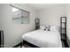 Simple bedroom with a window and motorcycle themed pillows on the bed at 8314 E Vista Dr, Scottsdale, AZ 85250