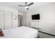 Contemporary bedroom featuring white sliding door closet and a wall-mounted TV at 8314 E Vista Dr, Scottsdale, AZ 85250