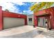 Modern home with a two-car garage, attractive entryway, and xeriscaping at 8314 E Vista Dr, Scottsdale, AZ 85250