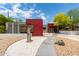 Striking facade with gravel yard, stepping stone walkway, and modern, artistic desert landscaping at 8314 E Vista Dr, Scottsdale, AZ 85250