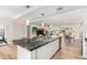 Modern kitchen with a large island, open floor plan, pendant lighting, and stainless steel appliances, perfect for entertaining at 8314 E Vista Dr, Scottsdale, AZ 85250