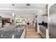 Well-designed kitchen open to living space, features stainless steel appliances, granite countertops, and modern pendant lighting at 8314 E Vista Dr, Scottsdale, AZ 85250