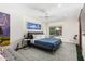 Bright main bedroom with a ceiling fan and glass doors leading to the pool at 8314 E Vista Dr, Scottsdale, AZ 85250