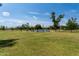 Expansive green park with lake, trees, and walking paths, offering a serene environment for recreation at 8314 E Vista Dr, Scottsdale, AZ 85250