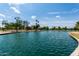 Picturesque view of Chaparral Park's lake surrounded by lush greenery, trees, and recreational areas at 8314 E Vista Dr, Scottsdale, AZ 85250