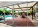 Inviting outdoor patio with a dining table, a canvas cover, and a view of the pool at 8314 E Vista Dr, Scottsdale, AZ 85250