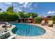 Backyard pool featuring lounge chairs, mature landscaping, and plenty of space for outdoor enjoyment at 8314 E Vista Dr, Scottsdale, AZ 85250