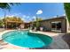 Inviting pool, patio with covered outdoor seating, landscaping, and seamless indoor-outdoor living at 8314 E Vista Dr, Scottsdale, AZ 85250