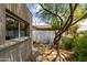 Cozy side yard with mature landscaping, a concrete block fence and plenty of shade at 8314 E Vista Dr, Scottsdale, AZ 85250