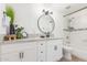 Clean bathroom with white cabinets, granite countertops, and a shower-tub combination at 8437 E Bonnie Rose Ave, Scottsdale, AZ 85250
