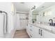 Bright bathroom with white cabinets, granite countertops, and modern fixtures at 8437 E Bonnie Rose Ave, Scottsdale, AZ 85250