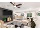 Open-concept living room flows into the kitchen with stainless steel appliances and a kitchen island with bar seating at 8437 E Bonnie Rose Ave, Scottsdale, AZ 85250