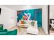 Stylish living room with colorful mural, white sofa, and gold accents at 8437 E Bonnie Rose Ave, Scottsdale, AZ 85250