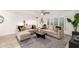 Neutral living room featuring two sofas, a dark coffee table, plantation shutters, and bright white walls at 8437 E Bonnie Rose Ave, Scottsdale, AZ 85250