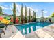 Refreshing pool area featuring painted mural, mature trees, and cool deck providing a delightful outdoor retreat at 8437 E Bonnie Rose Ave, Scottsdale, AZ 85250