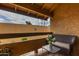 A cozy balcony offers a relaxing outdoor space with comfortable seating and scenic views at 8500 E Indian School Rd # 233, Scottsdale, AZ 85251