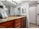 Bathroom vanity featuring granite countertops, undermount sink, and decorative accents at 8500 E Indian School Rd # 233, Scottsdale, AZ 85251