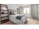 Inviting bedroom with a comfortable bed, natural light, and modern shelving units at 8500 E Indian School Rd # 233, Scottsdale, AZ 85251