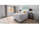 Cozy bedroom featuring a white bedspread, decorative pillows, and side tables with lamps at 8500 E Indian School Rd # 233, Scottsdale, AZ 85251