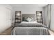 Relaxing bedroom with a bed, soft lighting, and decorative shelving at 8500 E Indian School Rd # 233, Scottsdale, AZ 85251